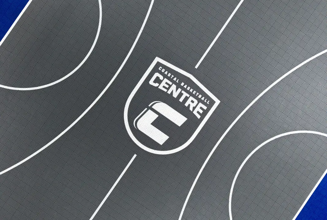 The Coastal Basketball Centre crest marked on the court floor
